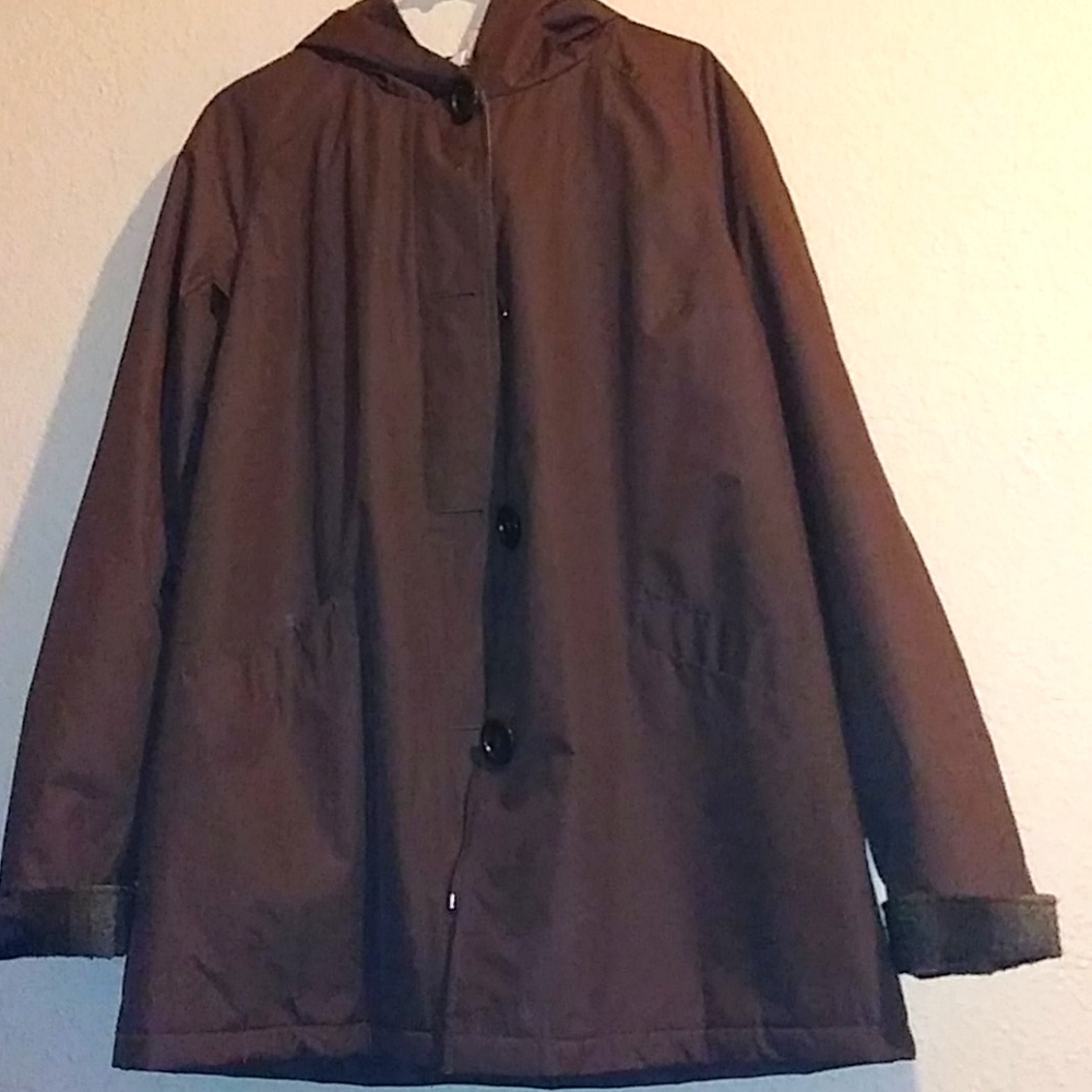 A warm quilt and wool winter coat with hood.